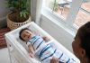 Ingenuity Contoured Changing Pad – Includes Waterproof Changing Liner and Safety Fastening Strap with Quick-Release Buckle Main |
