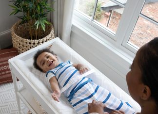 Ingenuity Contoured Changing Pad – Includes Waterproof Changing Liner and Safety Fastening Strap with Quick-Release Buckle