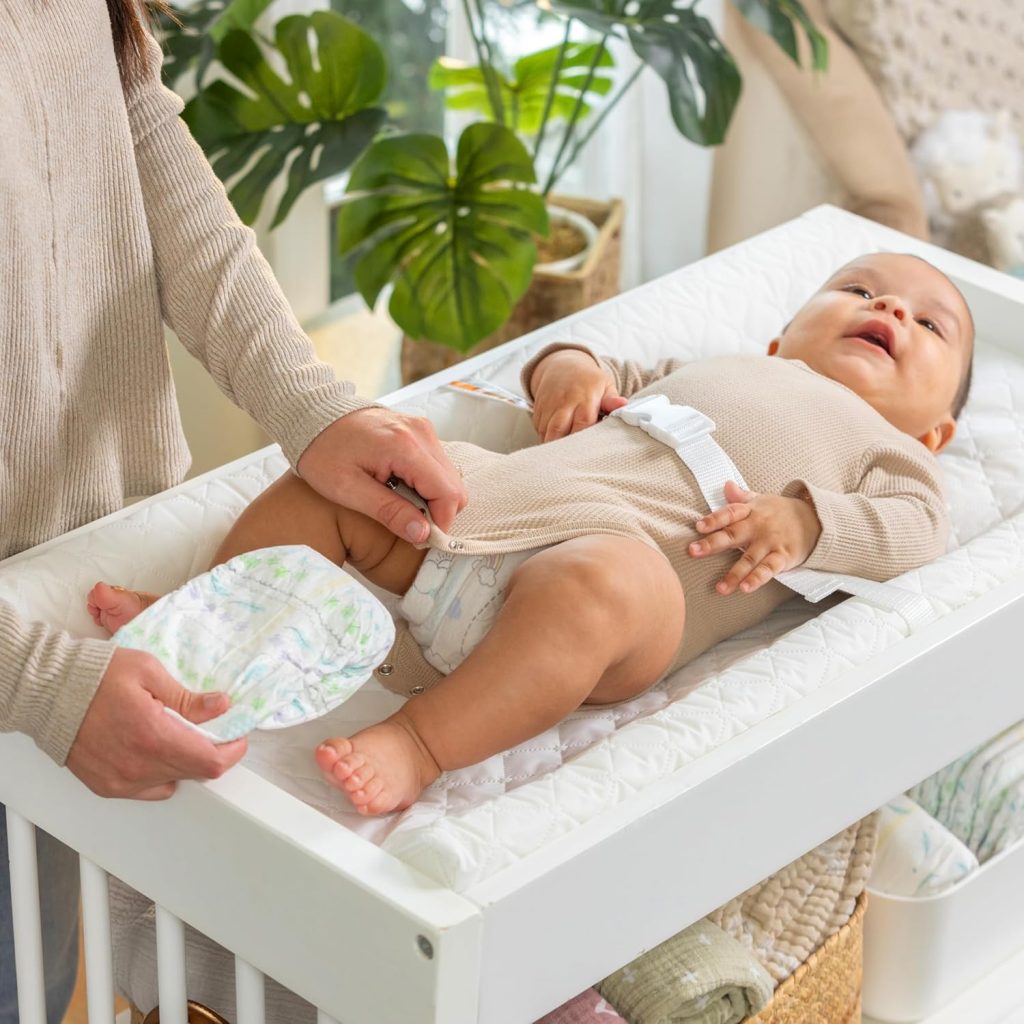 Ingenuity Contoured Changing Pad – Includes Waterproof Changing Liner and Safety Fastening Strap with Quick-Release Buckle Ingenuity Contoured Changing Pad – Includes Waterproof Changing Liner and Safety Fastening Strap with Quick-Release Buckle